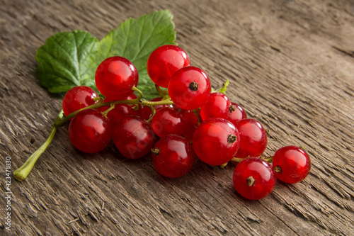 red currants on a wooden table