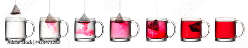 фотографія Process of making tea in glass cup on white background