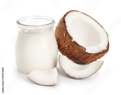 Jar of tasty coconut yogurt on white background