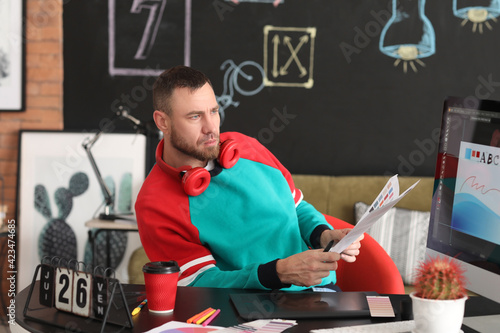Male designer working in of...