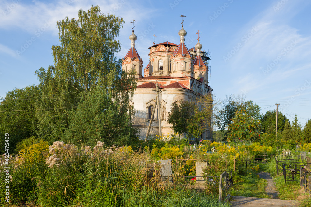 View of the ancient Church of the Life-Giving Trinity (1864) on a sunny August morning. Issad village, Leningrad region. Russia View of the ancient Church of the Life-Giving Trinity (1864) on a sunny August morning. Issad village, Leningrad region. Russia