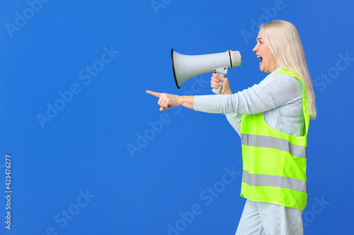 Mature woman in vest and wi...