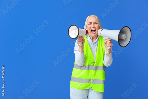 Mature woman in vest and wi...