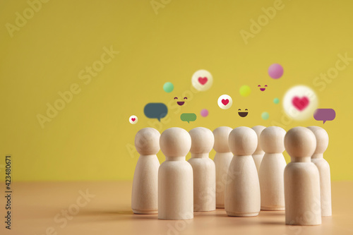 Psychology Personality Concept. Extrovert Person. person who Happy and Enjoy by Talking, Interaction, Party Often. presenting by wooden peg dolls photo
