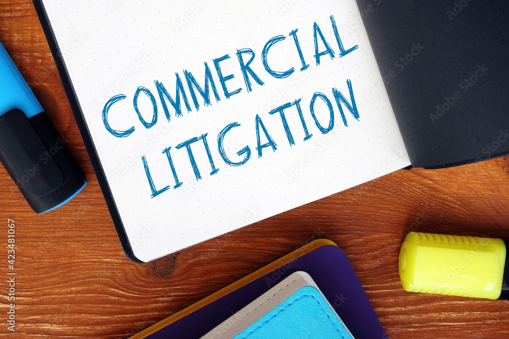Financial concept about COMMERCIAL LITIGATION exclamation marks with inscription on the sheet. Financial concept about COMMERCIAL LITIGATION exclamation marks with inscription on the sheet.