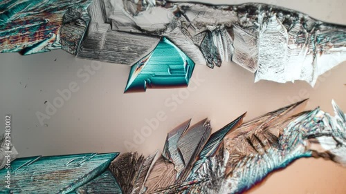 Time-lapse of crystallization Magnesium sulfate or Epsom Salt under polarized light. Formation of crystals under the microscope. 