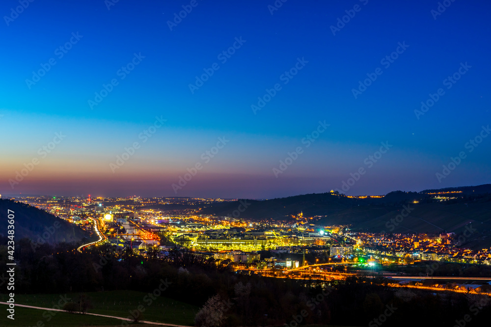 Germany, Magical sunset sky above houses, roofs and buildings near  neckar river of stuttgart city at dawning from above with glowing lights and starry sky