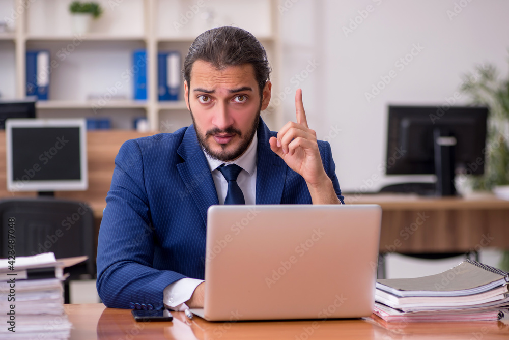 Young businessman employee working at workplace Young businessman employee working at workplace