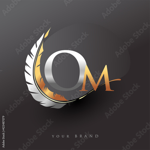 Initial letter OM logo with Feather Gold And Silver Color, Simple and Clean Design For Company Name. Vector Logo for Business and Company.