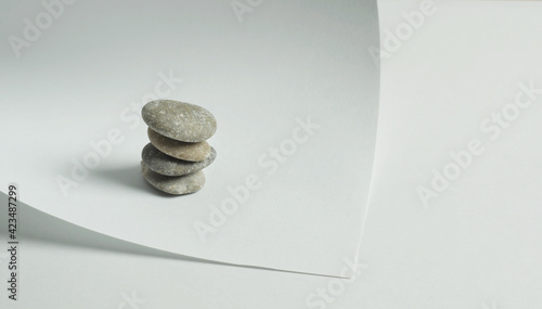 Canvas Print Light paper background with pyramids from stones