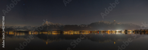 Night starry sky over lake Thun