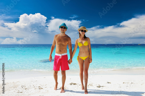 Couple walking on a tropical beach