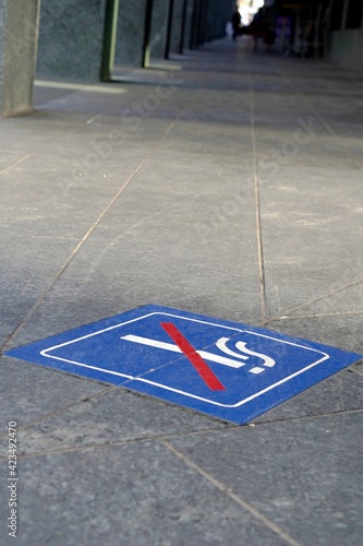 No smoking sign or smoking prohibited icon on the pavement of a street  in Switzerland.  © Lucia
