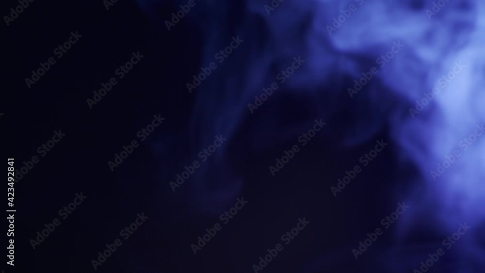 Abstract blue smoke in slow motion. Smoke, Cloud of cold fog in light spot background. Light, white, fog, cloud, black background, 4k, ice smoke cloud. Floating fog. Abstract blue smoke in slow motion. Smoke, Cloud of cold fog in light spot background. Light, white, fog, cloud, black background, 4k, ice smoke cloud. Floating fog.