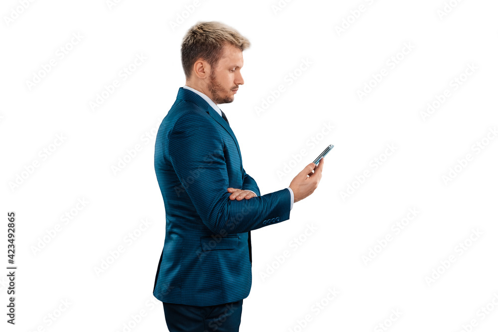 Man, Businessman in a business suit holds a smartphone in his hands is isolated on a white background. Uses the Internet for work and communication. concept Business online, remote work, freelance. Man, Businessman in a business suit holds a smartphone in his hands is isolated on a white background. Uses the Internet for work and communication. concept Business online, remote work, freelance.