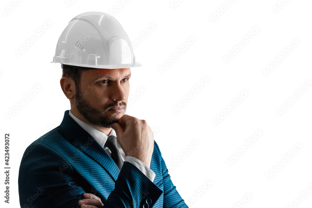 A man in a business suit, an architect with a white helmet on his head close-up, isolated on a white background. The concept of architecture, construction, blueprints, plan. A man in a business suit, an architect with a white helmet on his head close-up, isolated on a white background. The concept of architecture, construction, blueprints, plan.