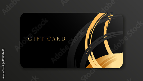 Elegant gift card design template. Black and gold cards with brush strokes isolated on dark background. Vector Template