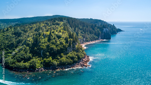 Aerial view of a beautiful harbour with rocky coastline. Coromandel, New Zealand.