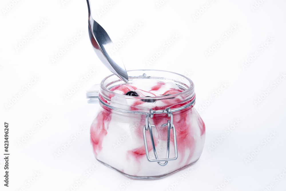 Ice cream and dessert spoon. Ice cream in a glass jar with fruit. Side view of ice cream in a glass jar. An open jar of ice cream. Ice cream and dessert spoon. Ice cream in a glass jar with fruit. Side view of ice cream in a glass jar. An open jar of ice cream.
