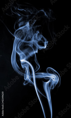 Blue curly smoke on a black background
