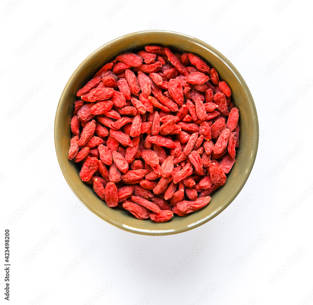 Goji berries in a bowl on white background Goji berries in a bowl on white background