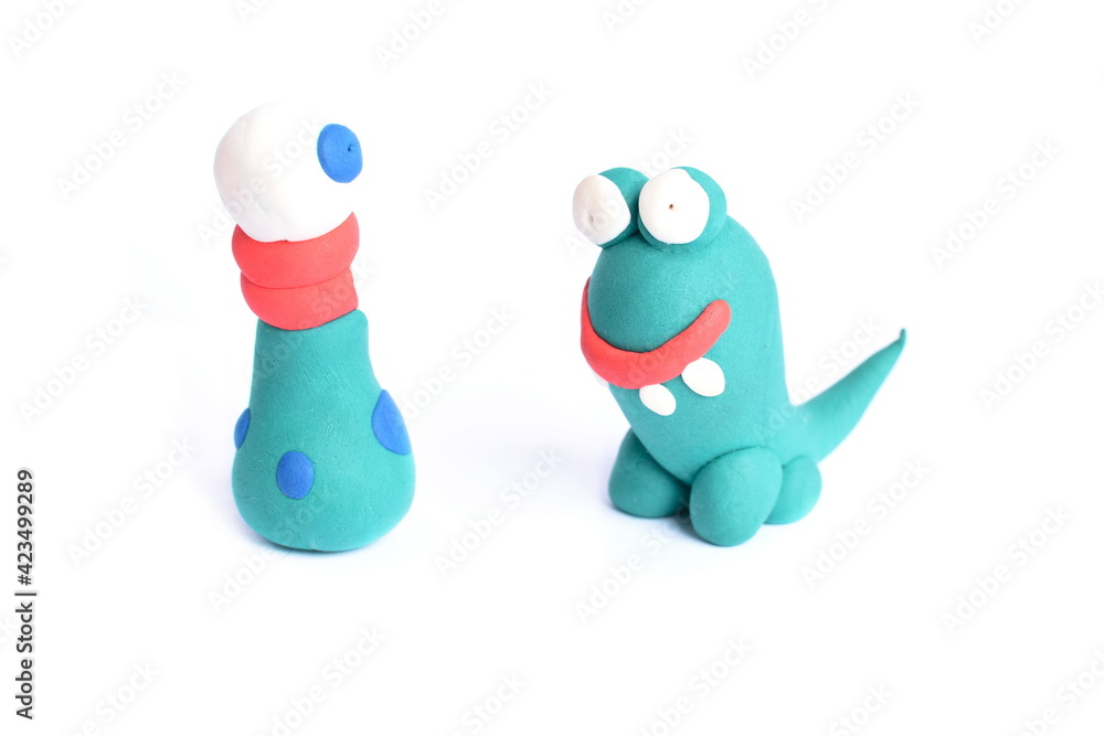 Hand made figurines, funny creatures made of plastic mass, modeling clay. Fancy, colorful characters.