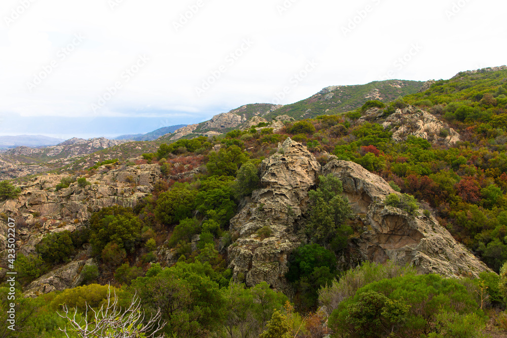 Beautiful scenery of the mountains in the Desert des Agriates with blue sky. Landscape near Saint Florent, Corsica, Deparment Haut-Corse. France. Beautiful scenery of the mountains in the Desert des Agriates with blue sky. Landscape near Saint Florent, Corsica, Deparment Haut-Corse. France.