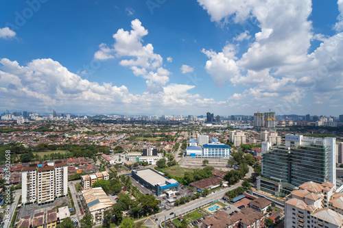 High rise view from top of city of Malaysia, blue sky, Selangor, Petaling Jaya, Kelana Jaya, UNITAR, Proton. © Bryan