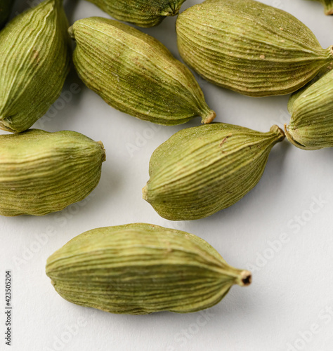 Wallpaper Mural Square photo of green whole dried cardamom seeds isolated on a white background Torontodigital.ca