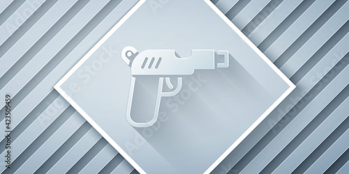 Paper cut Pistol or gun icon isolated on grey background. Police or military handgun. Small firearm. Paper art style. Vector
