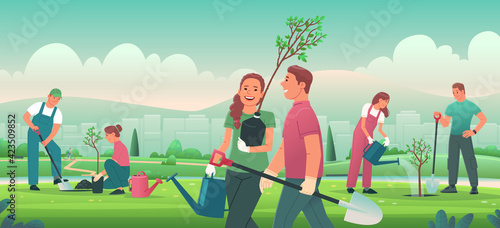 People are planting tree seedlings in the city park. Volunteers or city dwellers, men and women