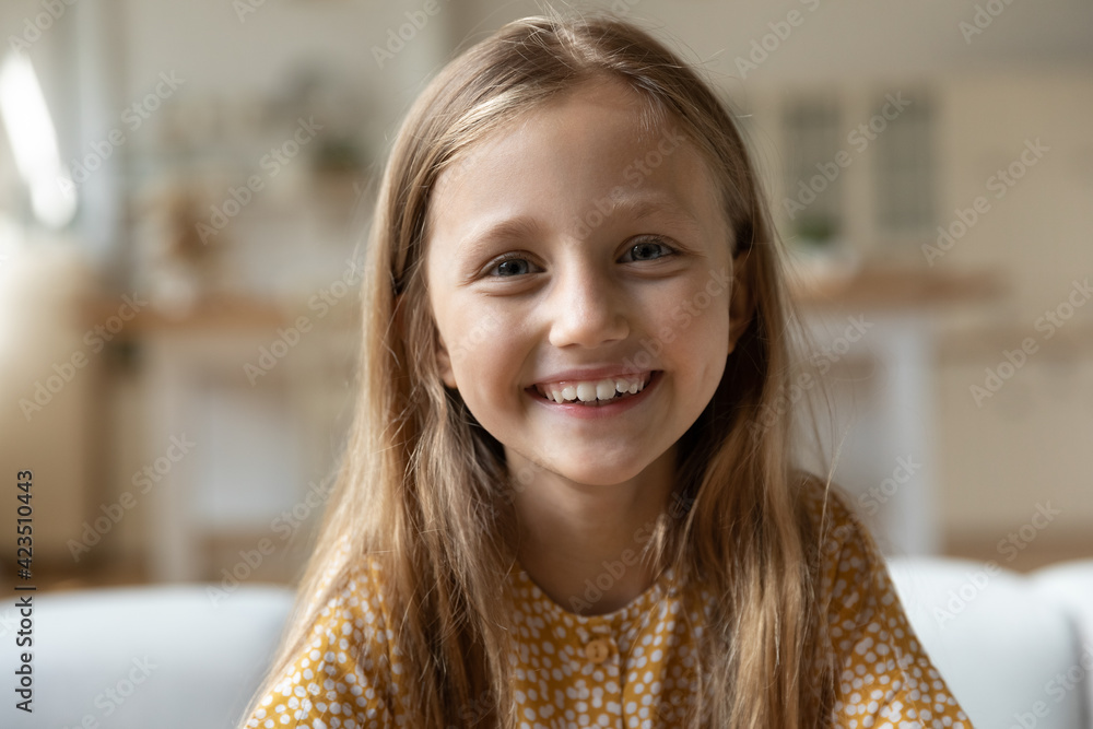 Kids and Sport. Side View of a Happy Little Girl Smiling at Camera