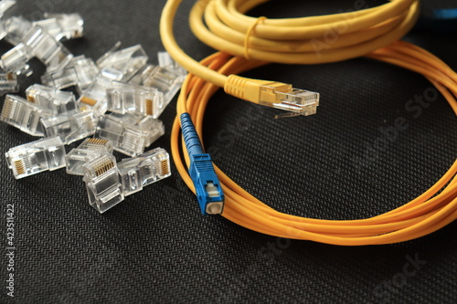 Connectors for internet connection. RJ-45. LAN cable. Optical patch cord.