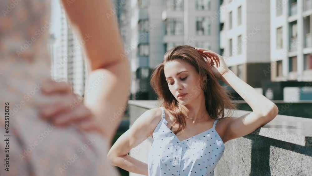Two girls girlfriends are walking around the city, going to a party, street photo. Models walk in the air all around the city. Two girls girlfriends are walking around the city, going to a party, street photo. Models walk in the air all around the city.
