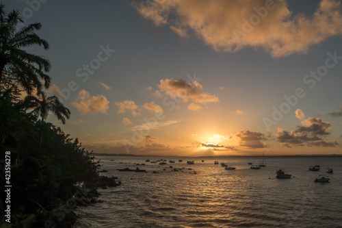 Beach sunset with boats and palm tree © Moises