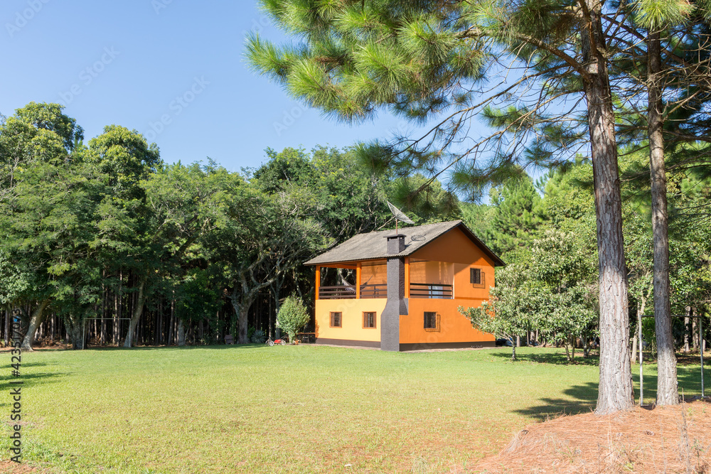 Little orange house in the forest