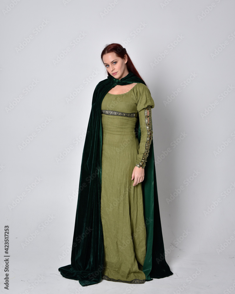 full length portrait of red haired girl wearing celtic, green medieval ...