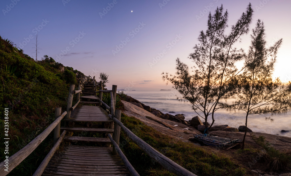 Stairs along the beach at sunrise