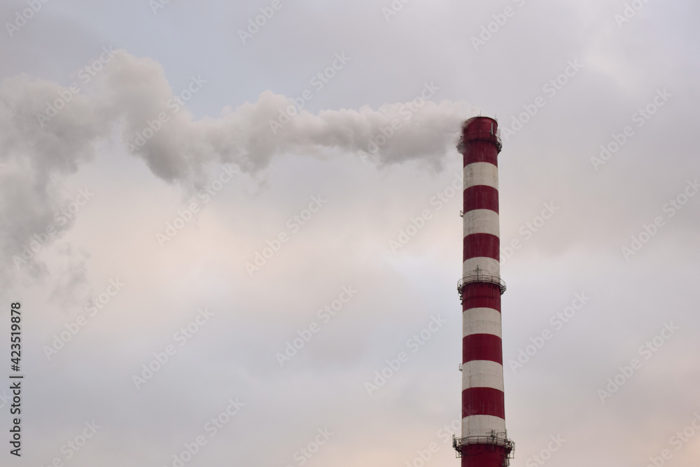 Smoking chimney of a factory or factory on the background of the sky Smoking chimney of a factory or factory on the background of the sky
