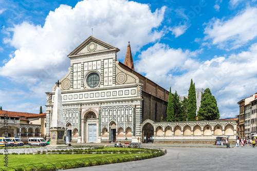 Exterior view of the Basilica of Santa Maria Novella in Florence, Italy, with its white marble facade in Renaissance style.