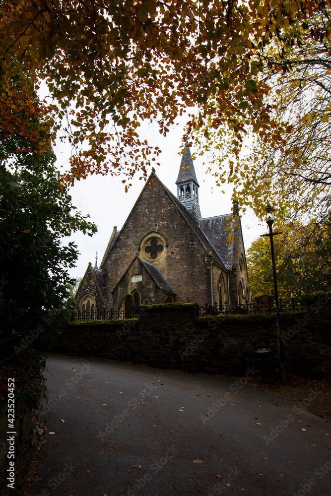An autumnal view of the church in the rural Scottish village of Luss 