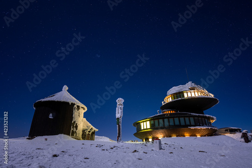 Obraz na płótnie peak of Sniezka mountain during winter at night with stars sky on Poland and Czech border w salonie