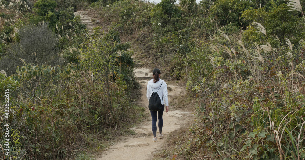 Woman hiking on the mountain Woman hiking on the mountain