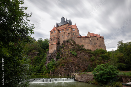 Medieval castle Kriebstein in front of a water cascade