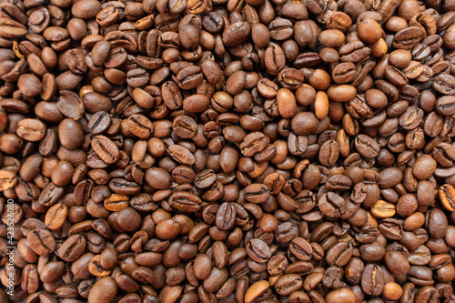 Background from coffee beans.Many roasted coffee coffees.