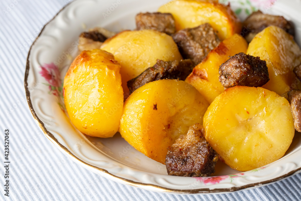 From traditional delicious Turkish food; potato and meat dish in casserole (Turkish name; Guvec tas kebabi, tandir) From traditional delicious Turkish food; potato and meat dish in casserole (Turkish name; Guvec tas kebabi, tandir)