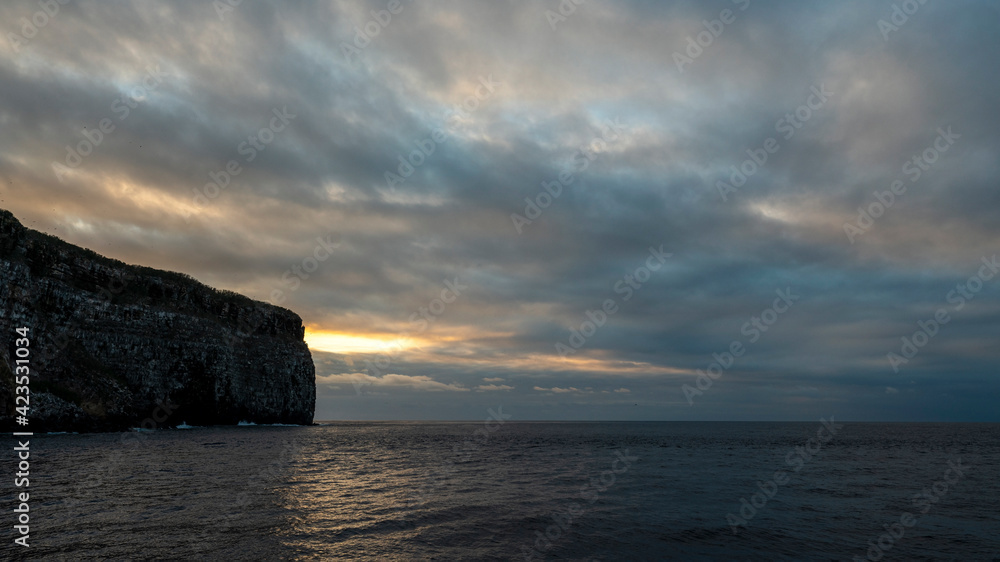 Sun sets at Wolf Island of Galapagos, one of the best dive destinations.