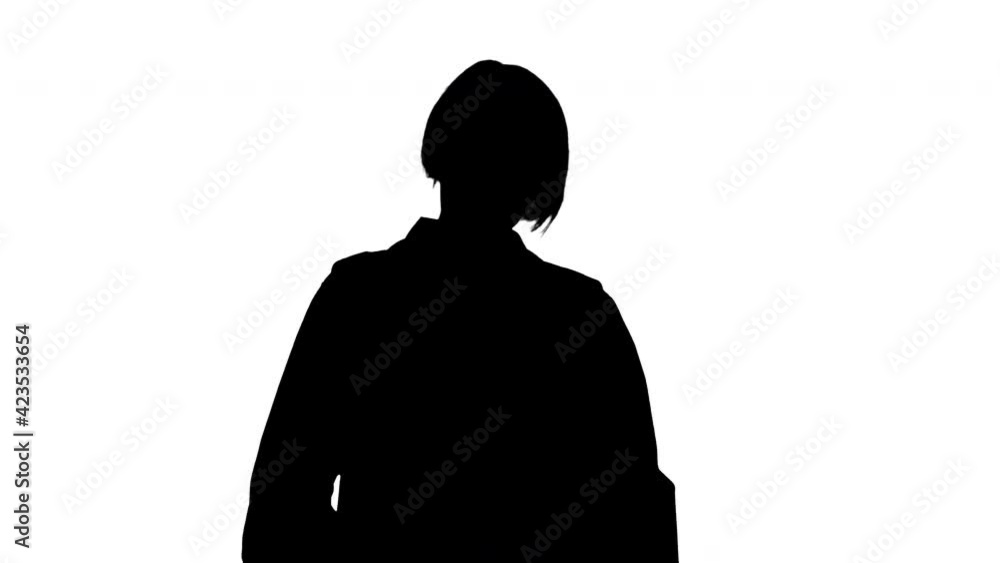 Silhouette Mature female doctor in glasses looking to camera seriously. Silhouette Mature female doctor in glasses looking to camera seriously.