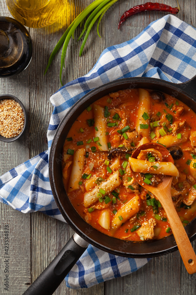 Traditional Korean Tteokbokki rice noodles with chicken, vegetables and shitake mushrooms. Prepared in a pan. Traditional Korean Tteokbokki rice noodles with chicken, vegetables and shitake mushrooms. Prepared in a pan.