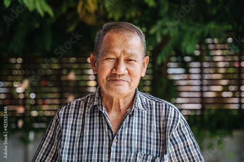 close-up portrait of smile asian senior man looking at camera. Old thai man.